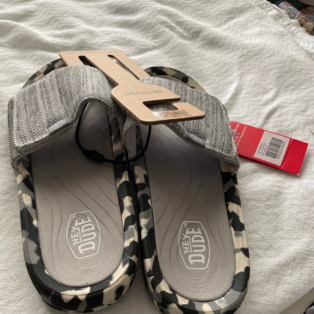 Men’s Hey Dude slides .